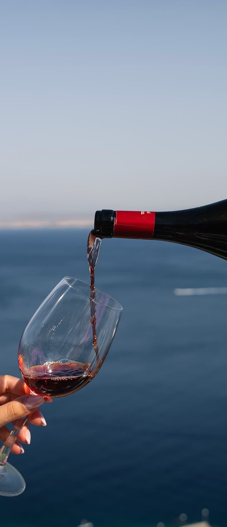 A glass of wine poured at the Thyrea wine bar in Crete