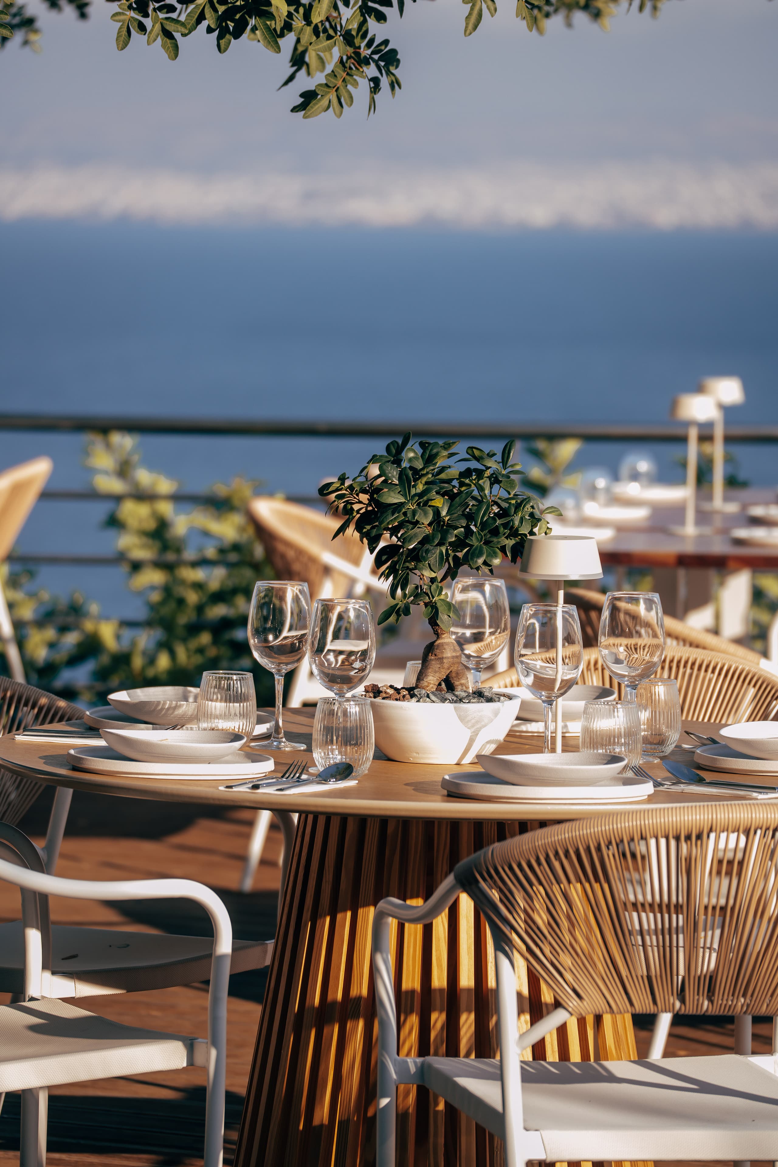 The interior of Thyrea restaurant in Thyseas, Crete, with natural materials and soft daylight